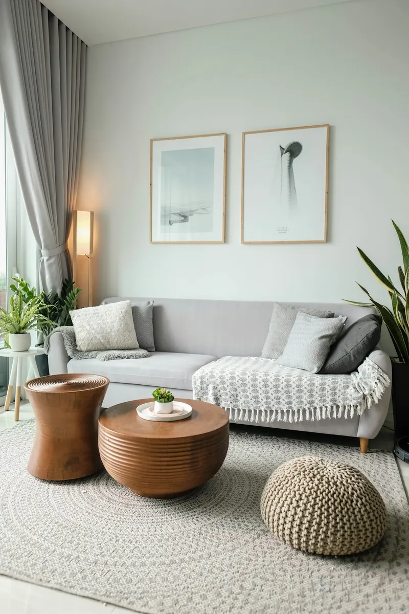 Clean, bright living room with sofa and woven rug